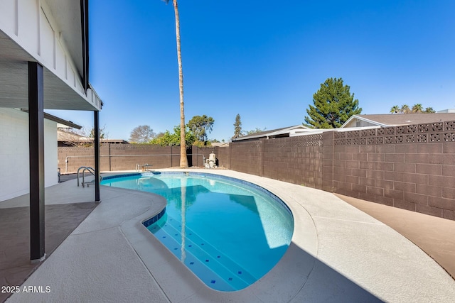 view of swimming pool featuring a patio, a fenced backyard, and a fenced in pool