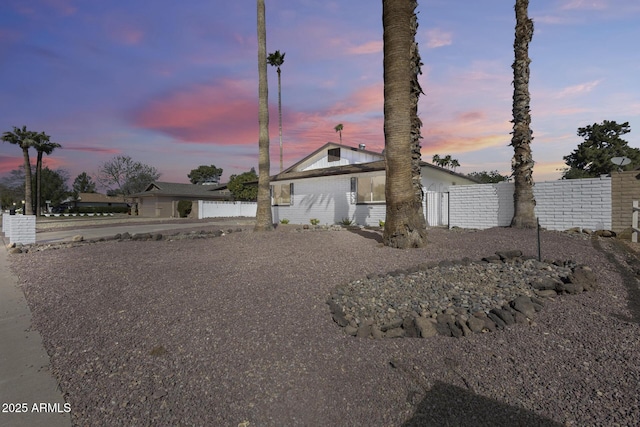 view of front of house featuring fence