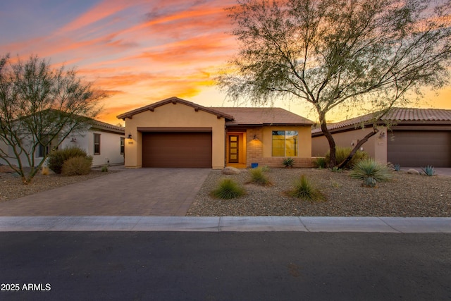 3285 Maverick Dr, Wickenburg, AZ 85390 - view of front facade with a garage, driveway, stucco siding, and a tiled roof