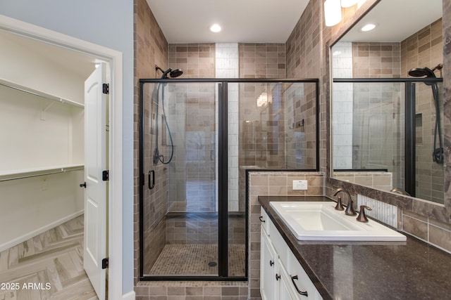 3285 Maverick Dr, Wickenburg, AZ 85390 - full bath with a spacious closet, vanity, a shower stall, and recessed lighting