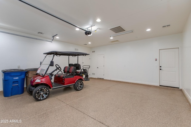 3285 Maverick Dr, Wickenburg, AZ 85390 - garage featuring a garage door opener, recessed lighting, and baseboards