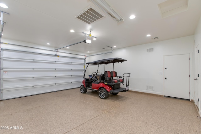 3285 Maverick Dr, Wickenburg, AZ 85390 - garage featuring a garage door opener, recessed lighting, and baseboards