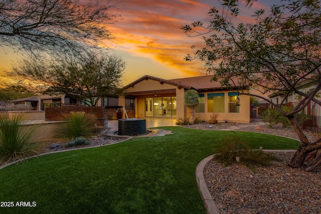 3285 Maverick Dr, Wickenburg, AZ 85390 - back of house featuring stucco siding and a patio area