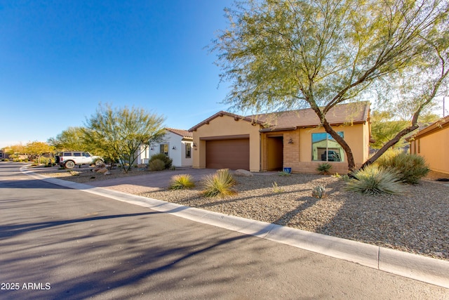 3285 Maverick Dr, Wickenburg, AZ 85390 - view of front facade featuring asphalt driveway, a garage, and stucco siding