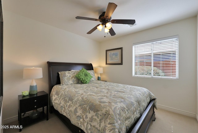 bedroom featuring carpet floors, a ceiling fan, and baseboards