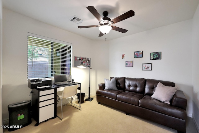 office area with ceiling fan, carpet flooring, visible vents, and baseboards