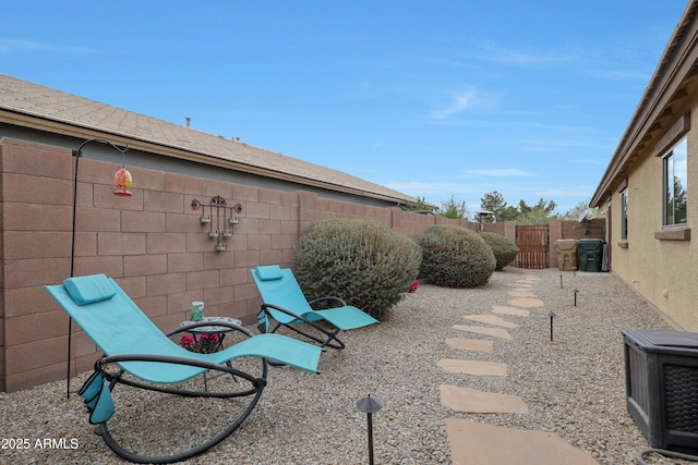 view of patio / terrace featuring fence private yard and a gate