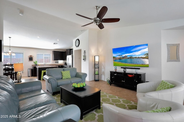 living area featuring recessed lighting, vaulted ceiling, baseboards, and ceiling fan