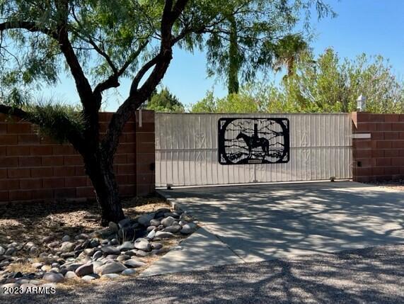 view of gate featuring fence