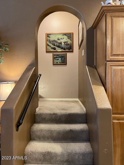 stairs featuring baseboards