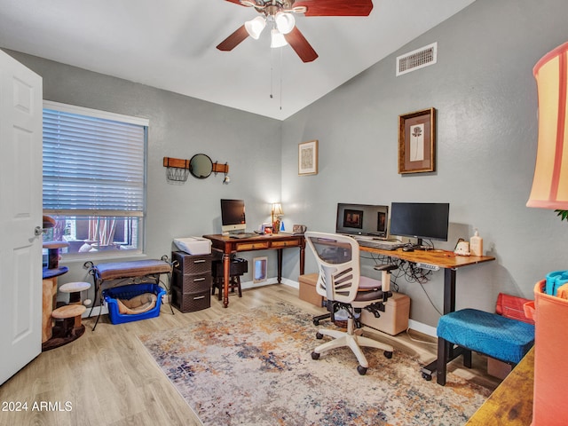 office featuring light hardwood / wood-style flooring, vaulted ceiling, and ceiling fan