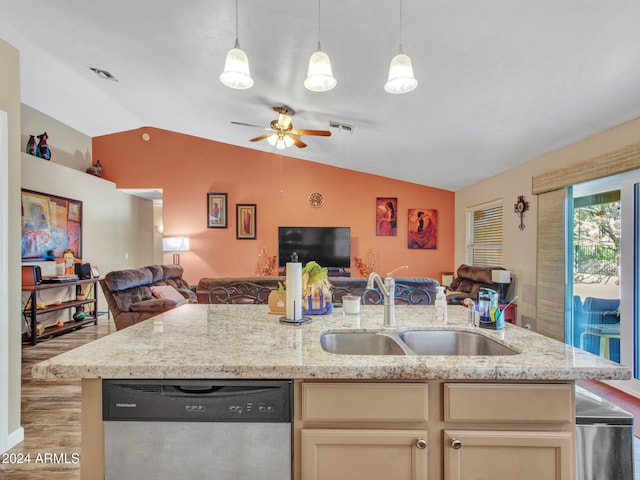 kitchen featuring lofted ceiling, sink, light stone counters, a center island with sink, and stainless steel dishwasher