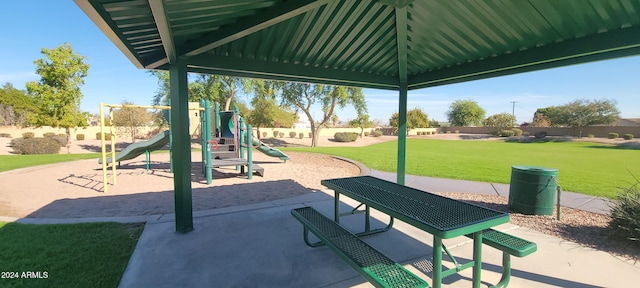 view of playground featuring a lawn