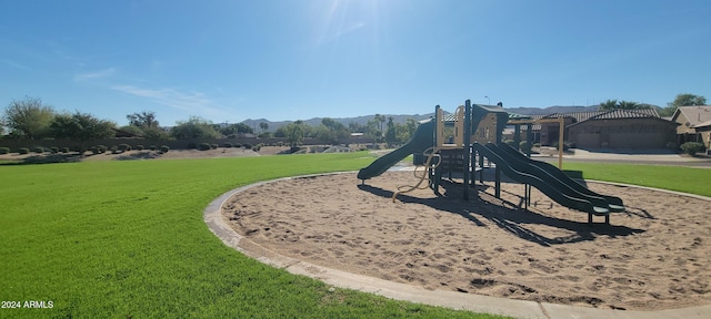 view of jungle gym with a lawn