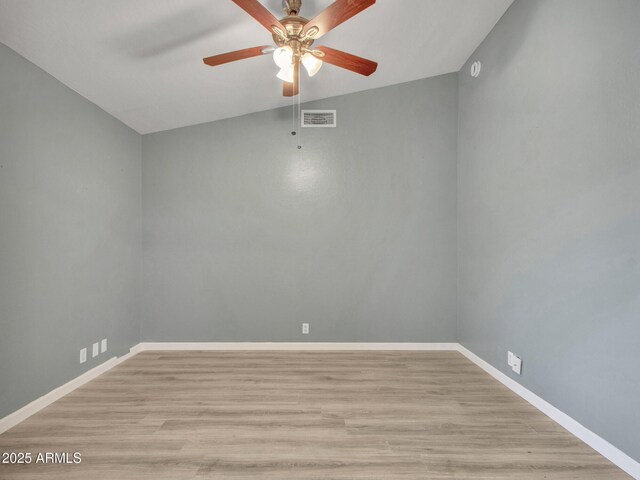 empty room featuring ceiling fan and light hardwood / wood-style floors