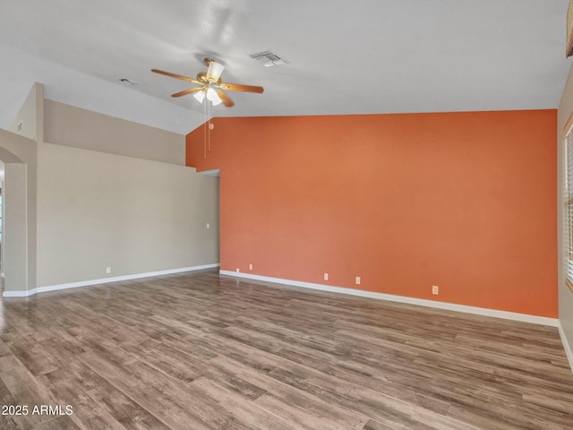 unfurnished room featuring ceiling fan, lofted ceiling, and hardwood / wood-style floors