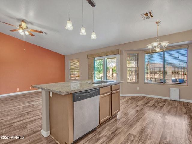 kitchen with hanging light fixtures, sink, an island with sink, and dishwasher