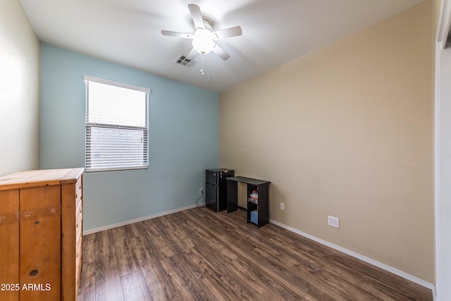 misc room with ceiling fan and dark hardwood / wood-style flooring