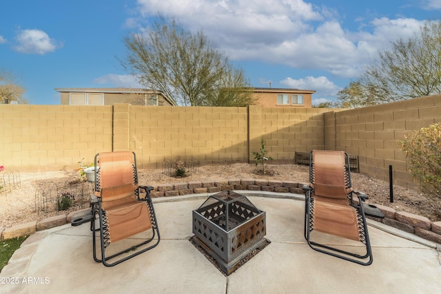 view of patio / terrace featuring an outdoor fire pit