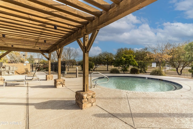 view of swimming pool featuring a pergola and a patio