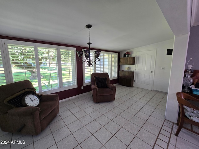 living room featuring light tile patterned floors, lofted ceiling, and an inviting chandelier