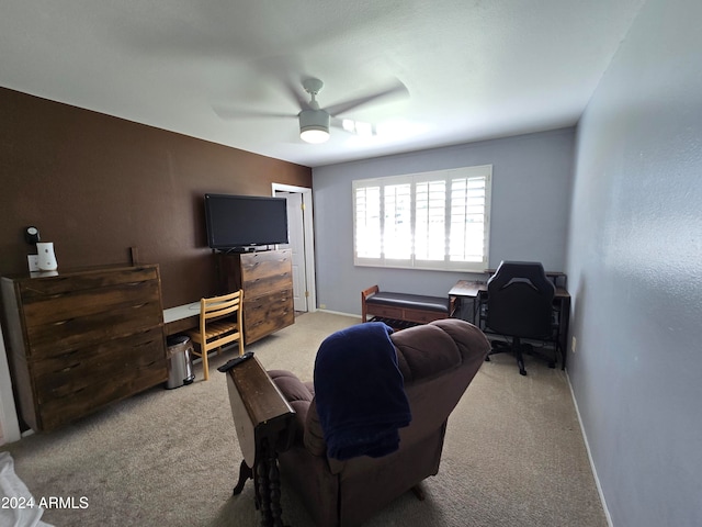 carpeted living room featuring ceiling fan