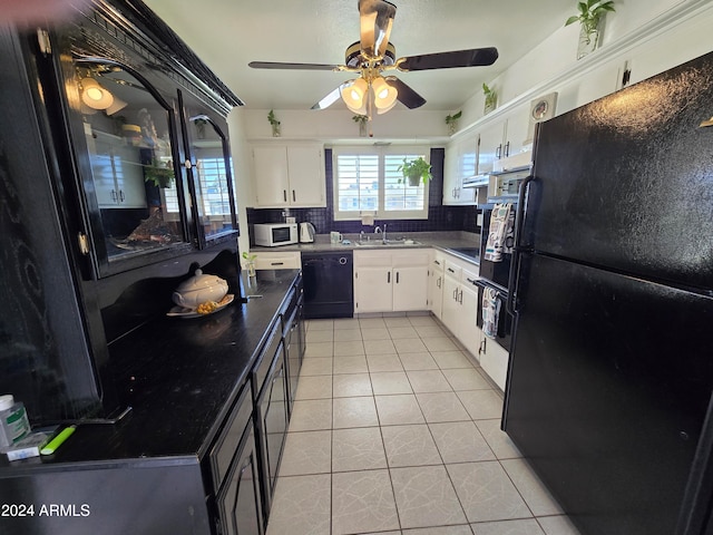 kitchen with white cabinetry, sink, decorative backsplash, light tile patterned floors, and black appliances