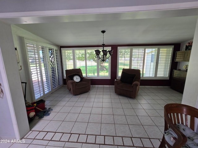 unfurnished living room featuring a chandelier and light tile patterned floors