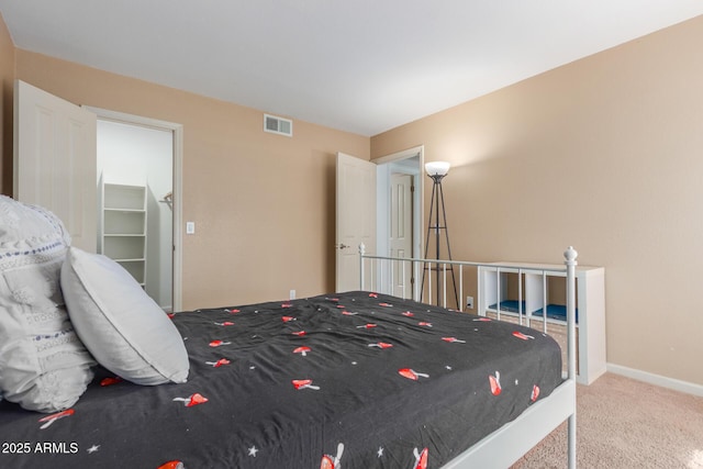 bedroom with baseboards, visible vents, and carpet flooring