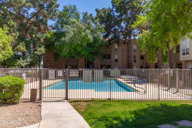 pool featuring a patio and fence