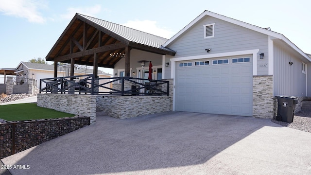 view of front of house featuring a porch and a garage