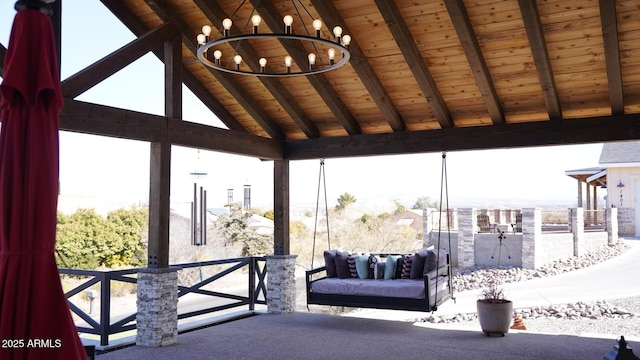 exterior space with vaulted ceiling with beams, a chandelier, and wood ceiling