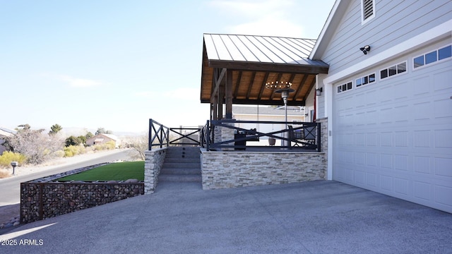 view of patio / terrace featuring a garage