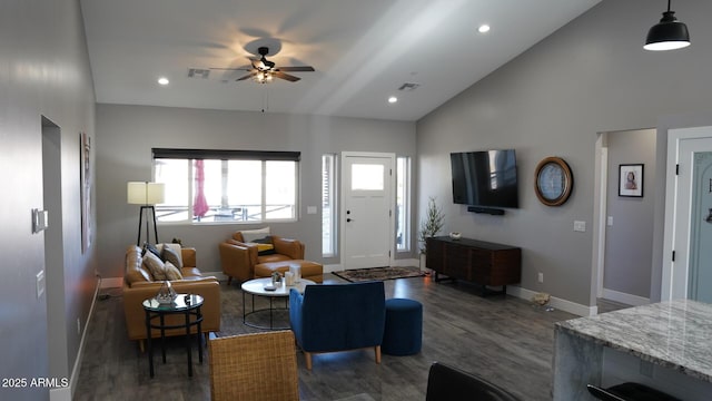 living room featuring a wealth of natural light, high vaulted ceiling, dark hardwood / wood-style floors, and ceiling fan