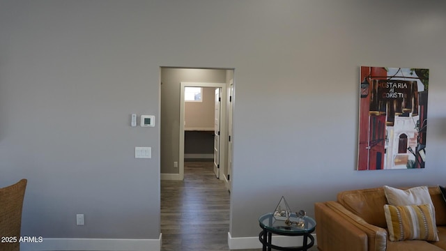 corridor with dark hardwood / wood-style flooring