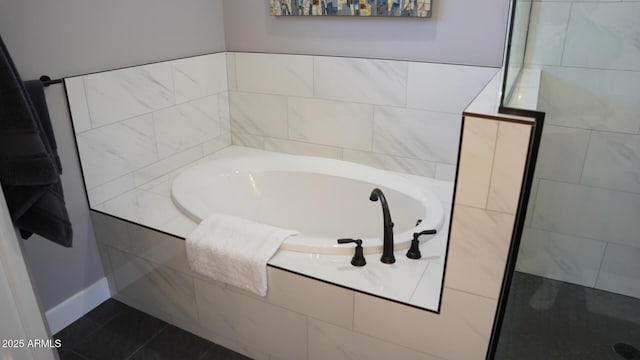 bathroom featuring tile patterned floors and shower with separate bathtub