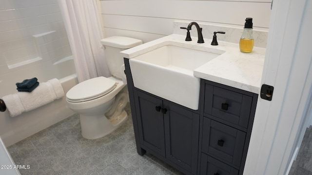 full bathroom featuring vanity, shower / tub combo, and toilet