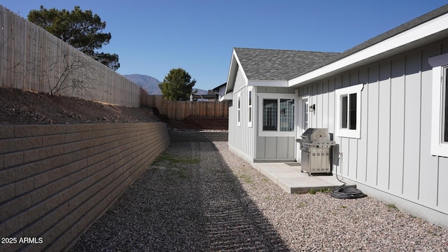 view of yard featuring a mountain view and a patio area