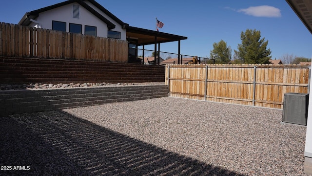 view of yard featuring central AC unit