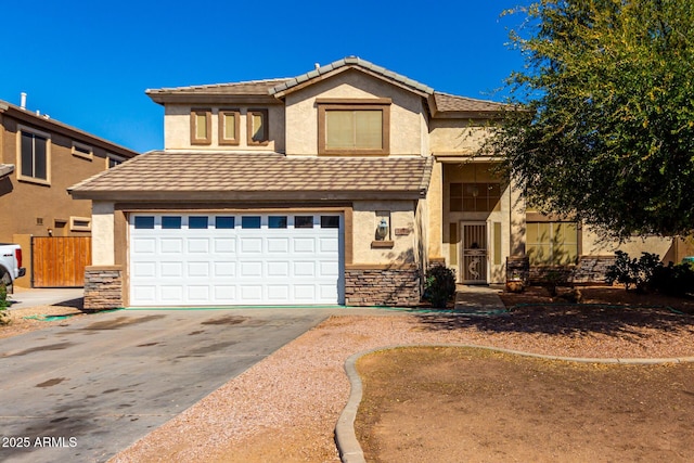 view of front of home with stone siding, driveway, an attached garage, and stucco siding
