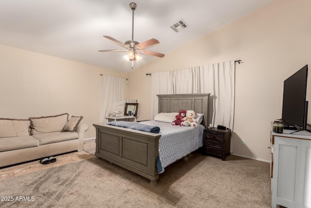 bedroom with vaulted ceiling, carpet, baseboards, ceiling fan, and visible vents