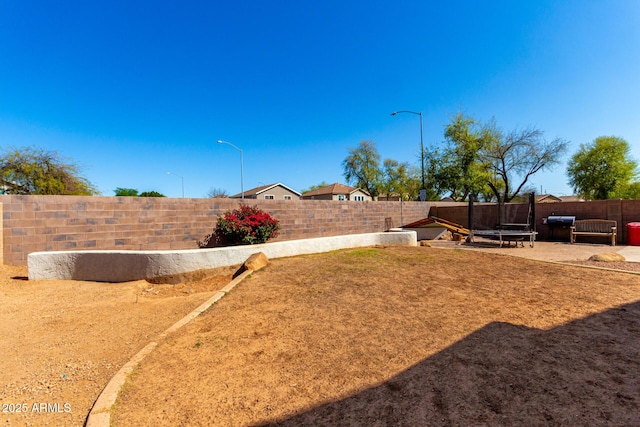 view of yard featuring a fenced backyard