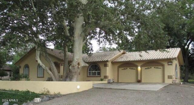 4165 E Beaver Vista Rd, Rimrock, AZ 86335 - mediterranean / spanish-style home featuring a garage