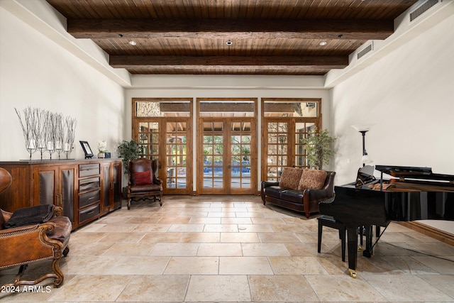 sitting room featuring beamed ceiling, french doors, and wooden ceiling