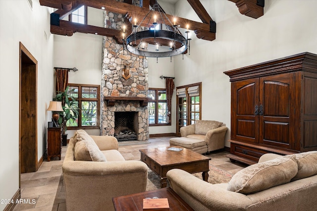 living room featuring a wealth of natural light, baseboards, and high vaulted ceiling