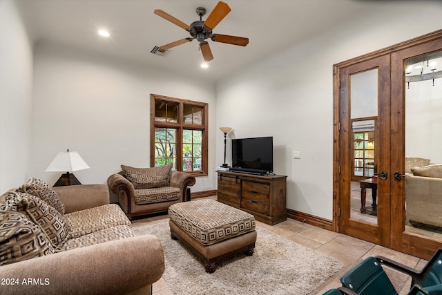 living area featuring a healthy amount of sunlight, ceiling fan, french doors, and visible vents