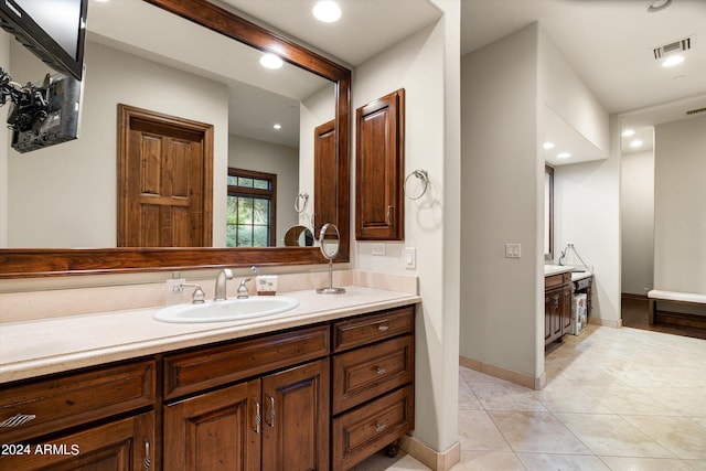 bathroom featuring vanity, recessed lighting, visible vents, and tile patterned flooring