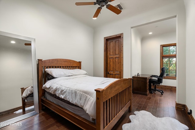 bedroom with ceiling fan and dark hardwood / wood-style floors