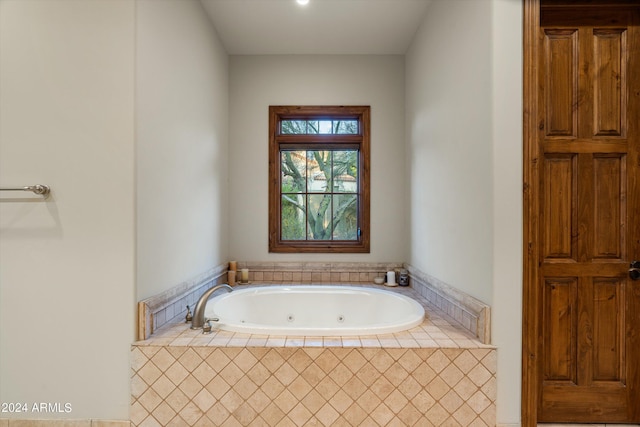 bathroom with a tub with jets