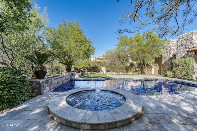 pool with an in ground hot tub